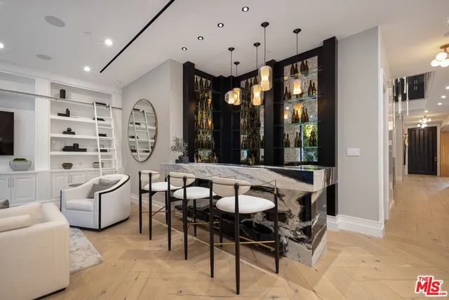 a room with pool table table and a couch