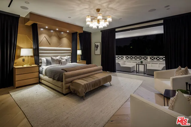 a kitchen with stainless steel appliances kitchen island granite countertop a red stove top oven and granite countertops with living room