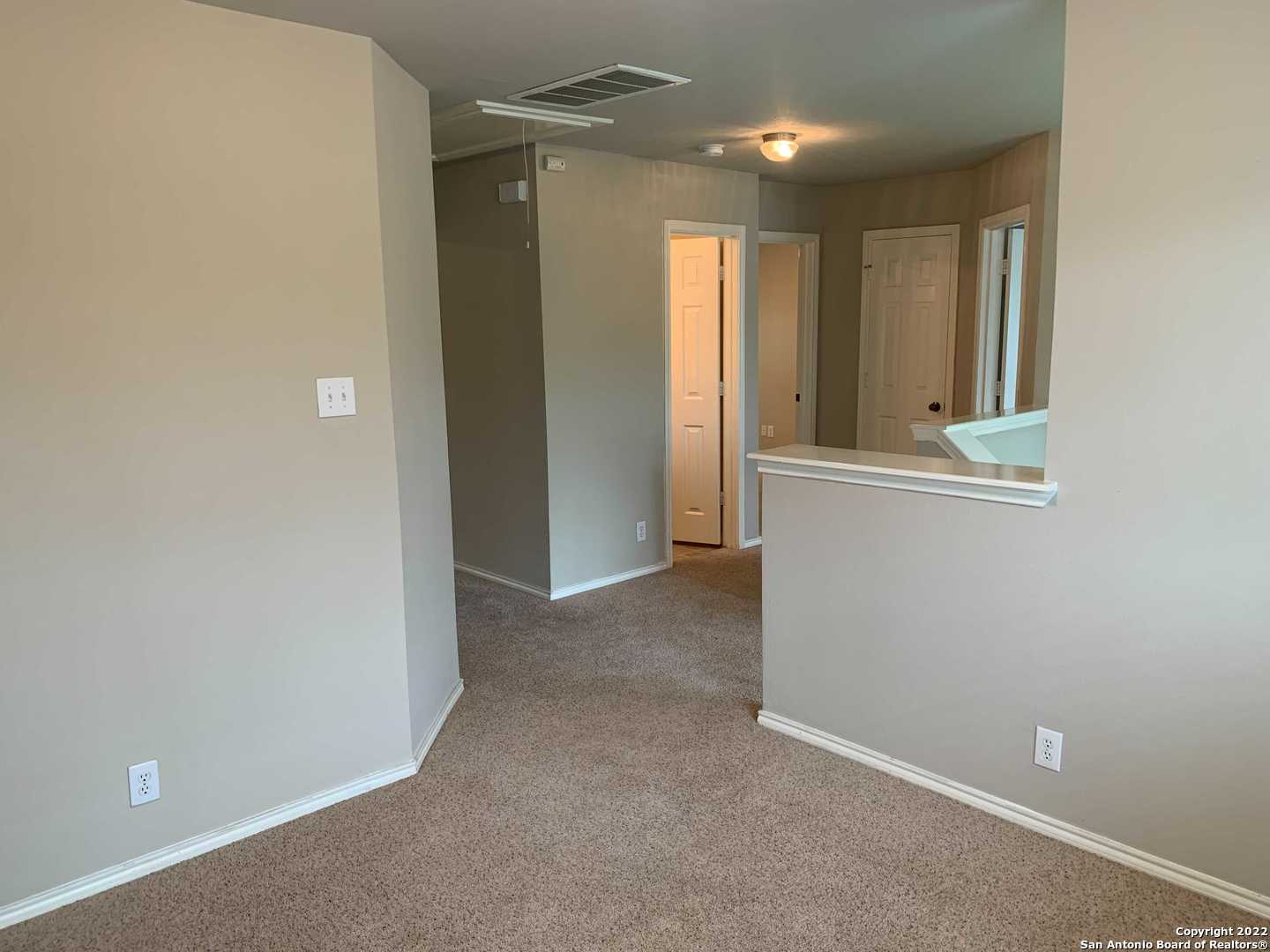 522 Cattle Ranch Drive San Antonio, TX 78245 - Photo 11 of 24 an empty room with window