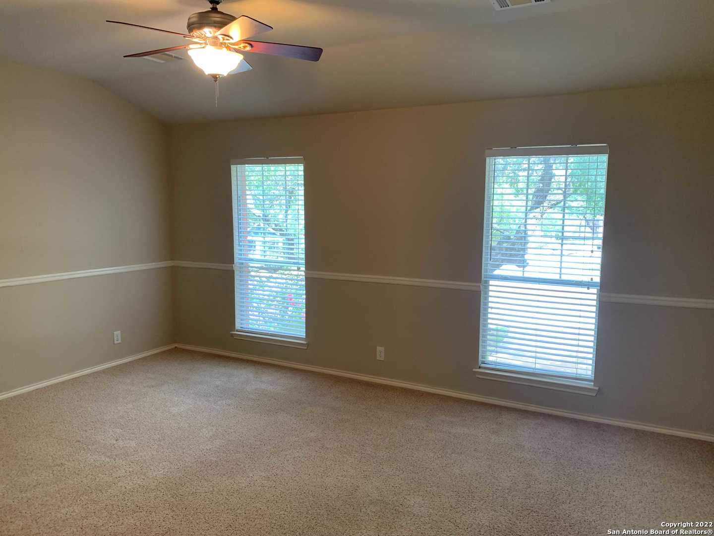 522 Cattle Ranch Drive San Antonio, TX 78245 - Photo 12 of 24 a view of an empty room with a window