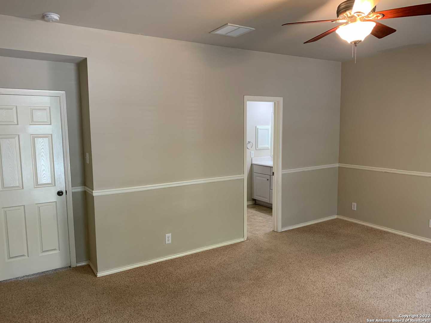 522 Cattle Ranch Drive San Antonio, TX 78245 - Photo 13 of 24 an empty room with closet and a chandelier fan