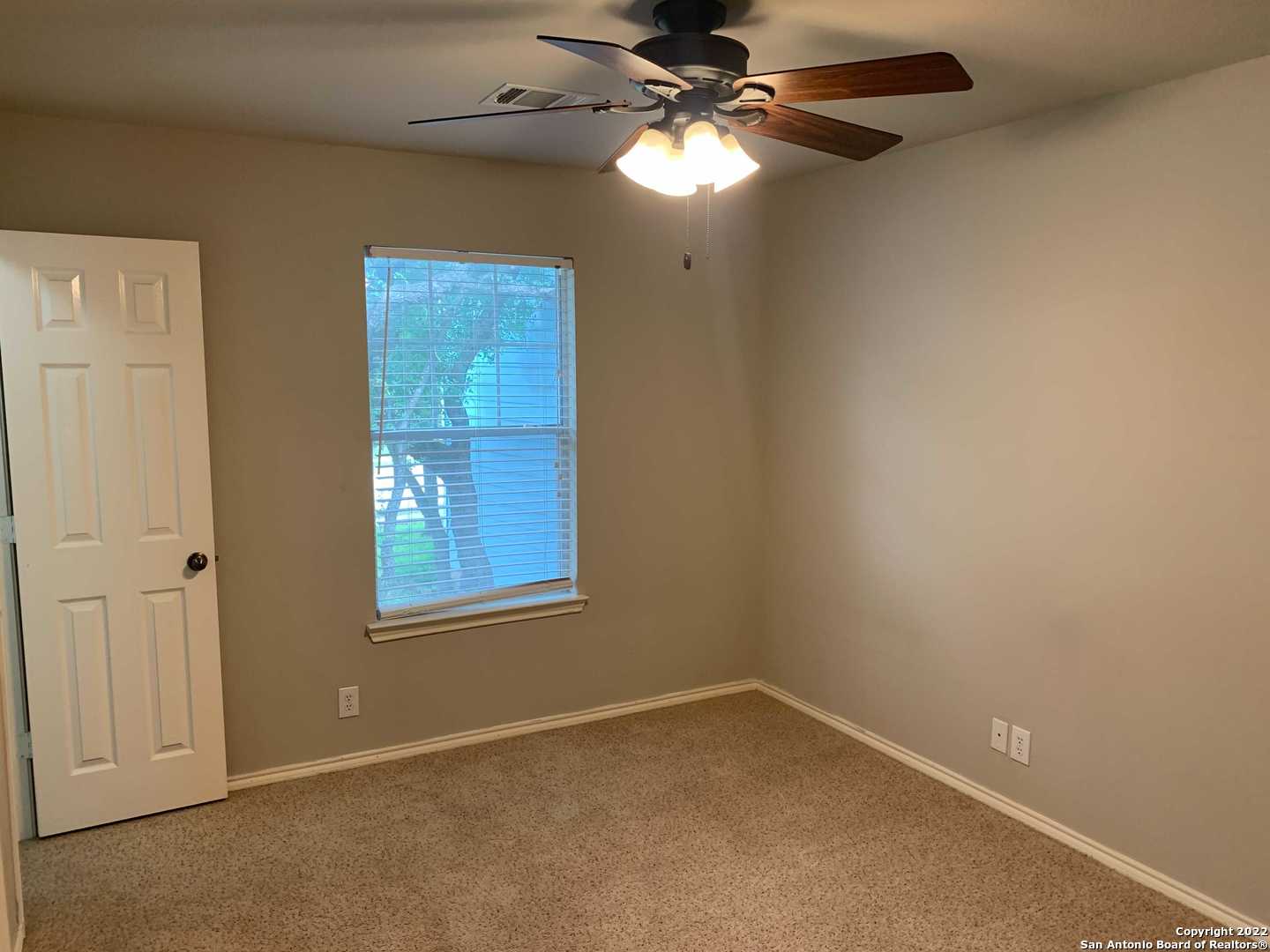 522 Cattle Ranch Drive San Antonio, TX 78245 - Photo 19 of 24 an empty room with windows and fan