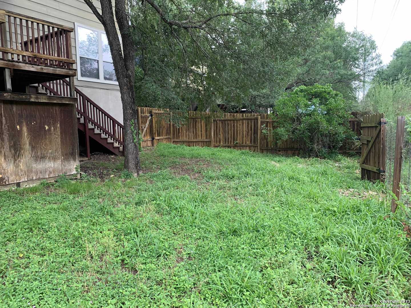 522 Cattle Ranch Drive San Antonio, TX 78245 - Photo 21 of 24 a view of a house with a yard