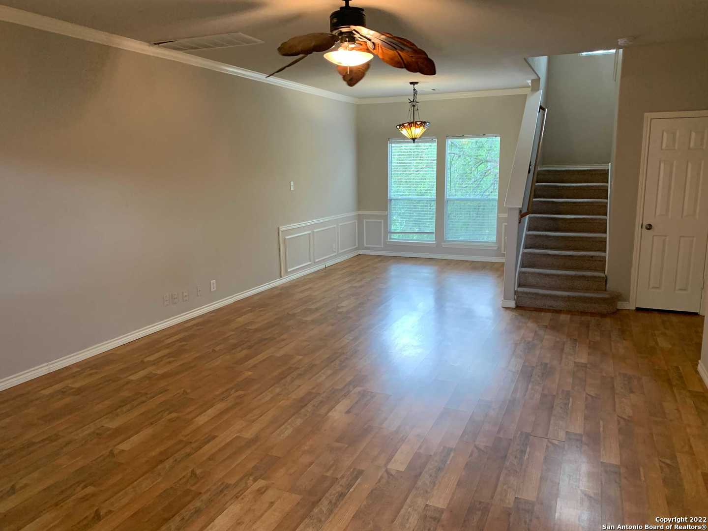 522 Cattle Ranch Drive San Antonio, TX 78245 - Photo 3 of 24 wooden floor in an empty room with a window