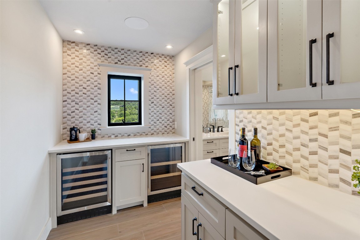 13824 Lone Rider Trail Austin, TX 78738 - Photo 14 of 40 a kitchen with a sink stove and cabinets