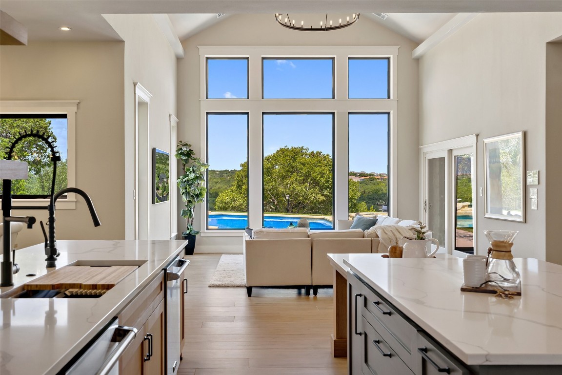 13824 Lone Rider Trail Austin, TX 78738 - Photo 2 of 40 a kitchen with a sink and a large window