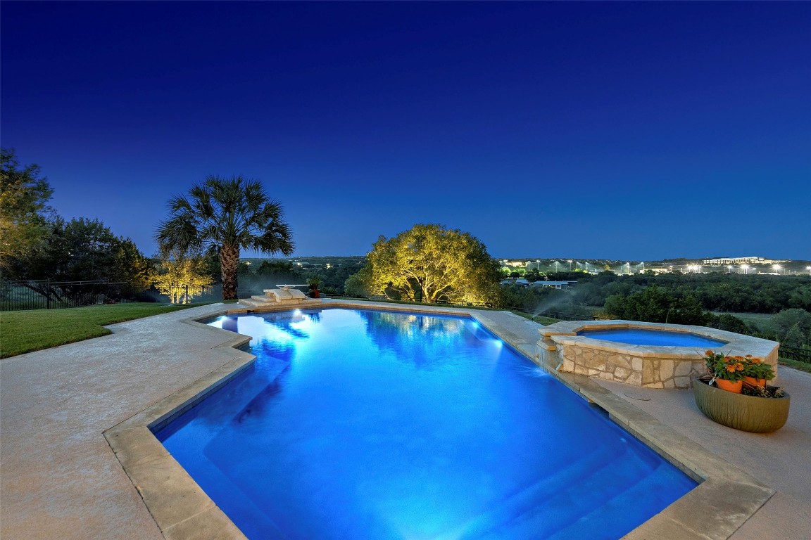 13824 Lone Rider Trail Austin, TX 78738 - Photo 25 of 40 a view of a swimming pool with a yard