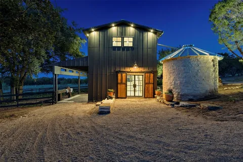 a view of an house with backyard space and porch