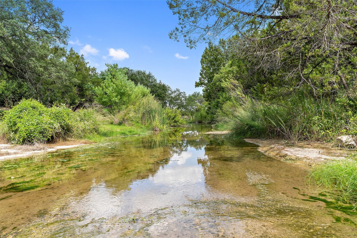 13824 Lone Rider Trail Austin, TX 78738 - Photo 29 of 40 a view of a lake from a yard