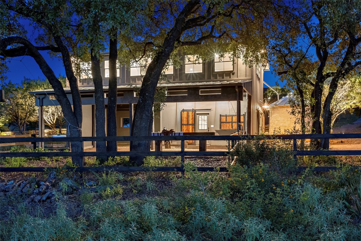 13824 Lone Rider Trail Austin, TX 78738 - Photo 33 of 40 a front view of a house with a yard