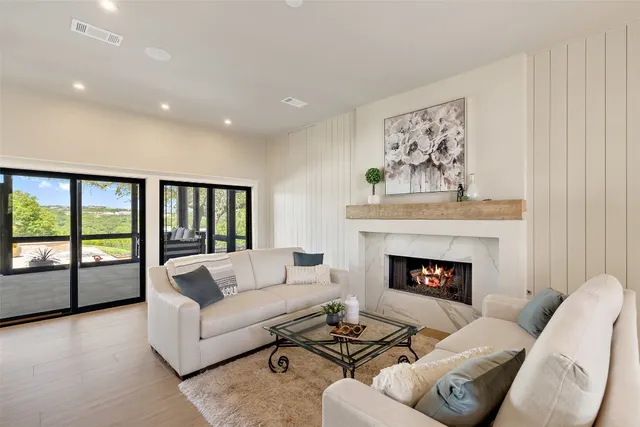 a living room with furniture and a fireplace