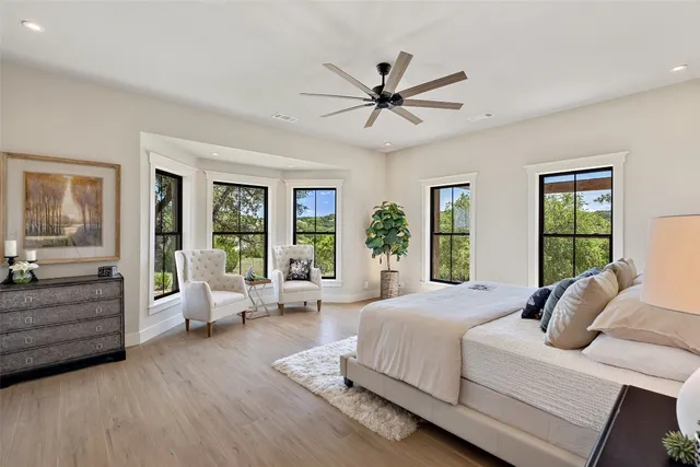 a bedroom with a large bed and a couch