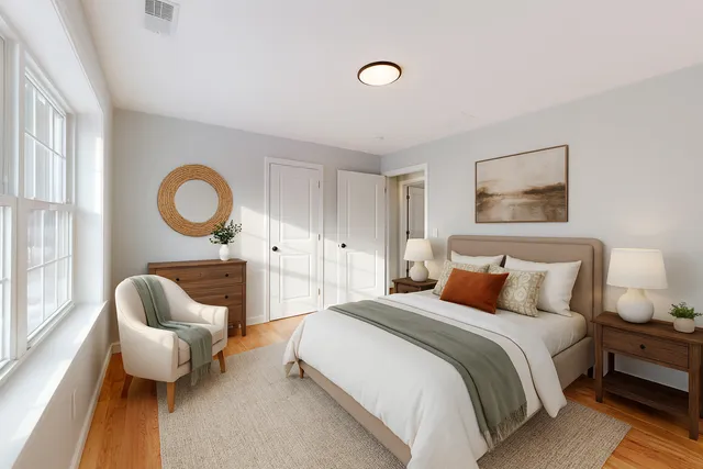 a bedroom with a bed and couch