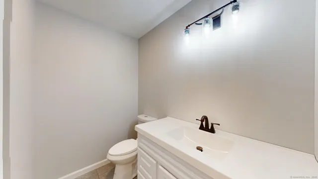 a white bath tub sitting next to a white toilet
