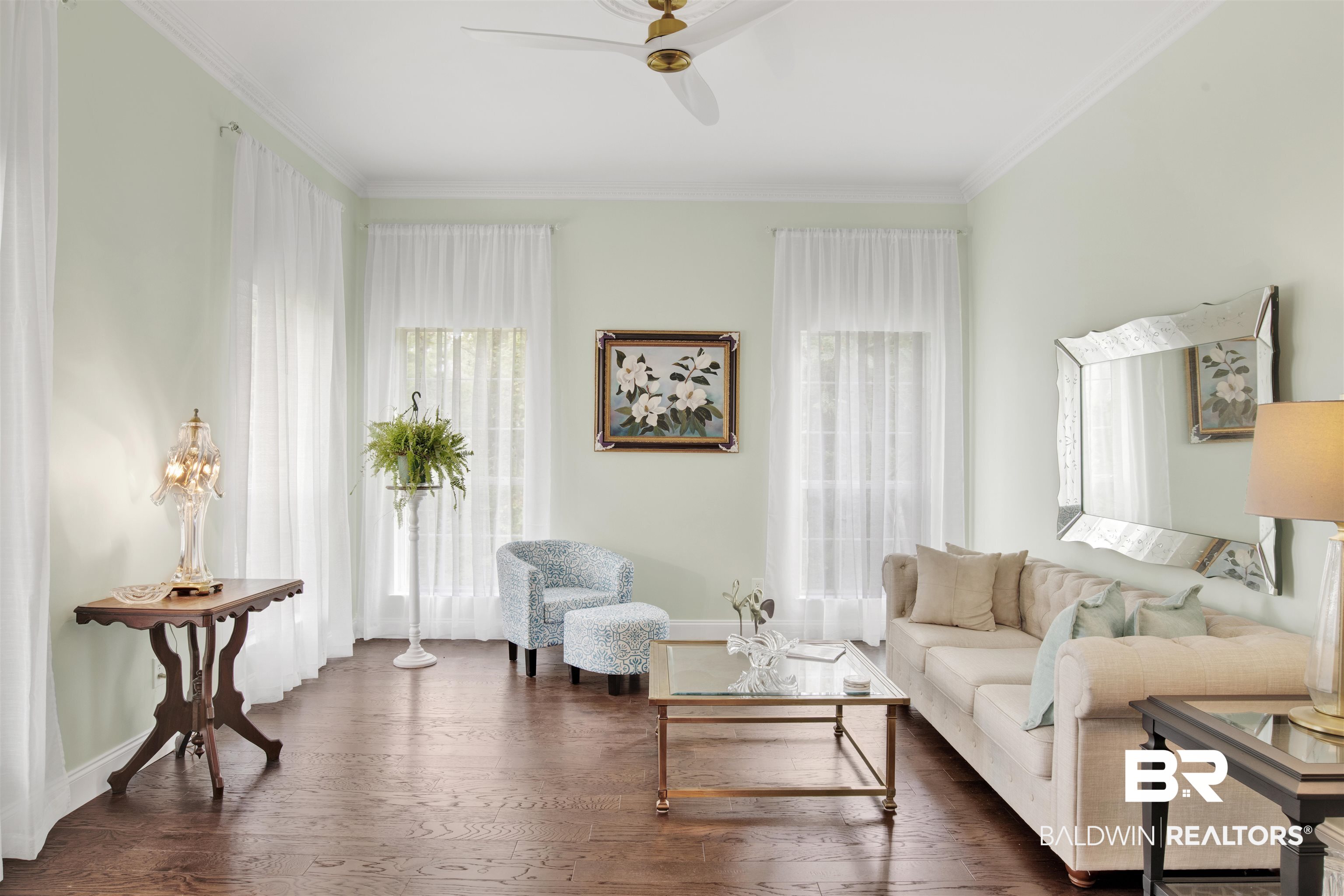 7641 Hitt Road Mobile, AL 36695 - Photo 4 of 29 Living room featuring ceiling fan, dark hardwood / wood-style floors, and ornamental molding