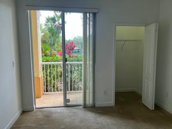 a view of empty room with floor to ceiling windows