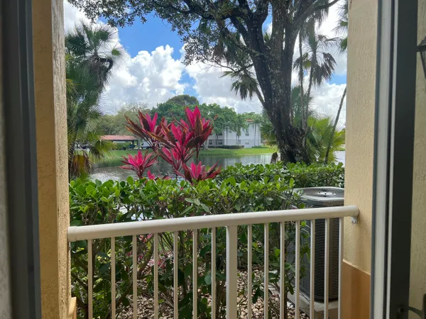 a view of a balcony with wooden fence