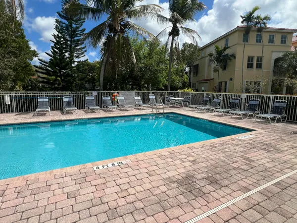 a view of a patio with swimming pool