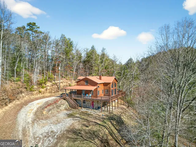 a view of entryway with wooden door