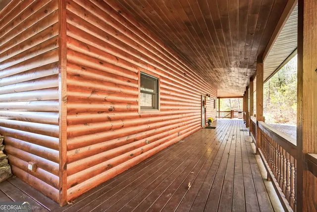 a kitchen with stainless steel appliances kitchen island granite countertop a refrigerator and cabinets