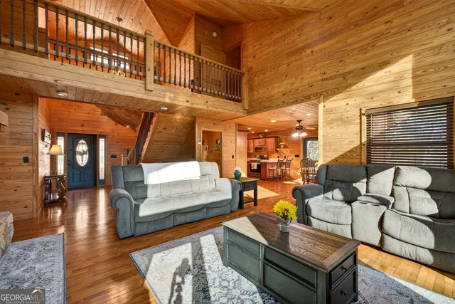 a view of an entryway with wooden floor