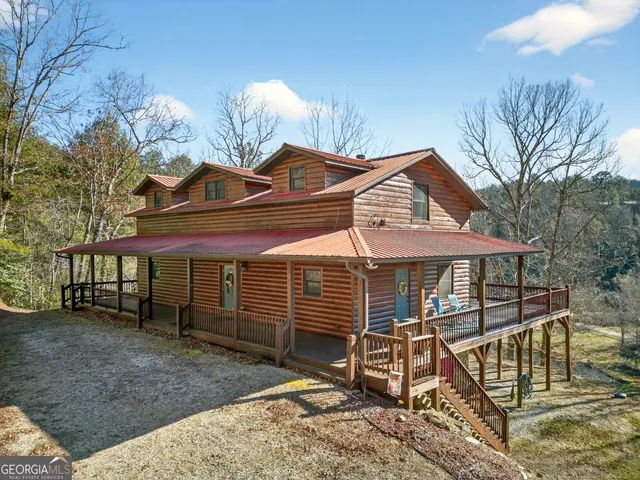 a view of a balcony with floor to ceiling windows and wooden floor