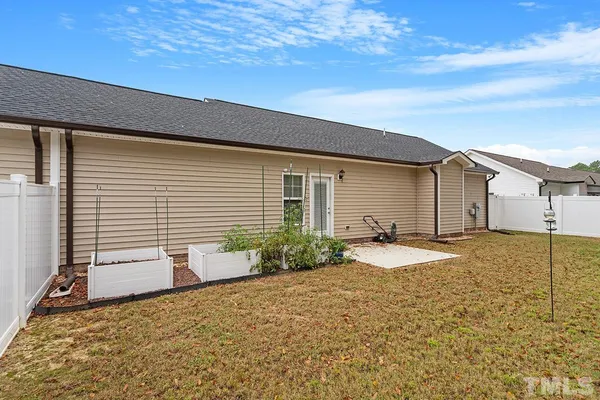 a house view with a backyard space