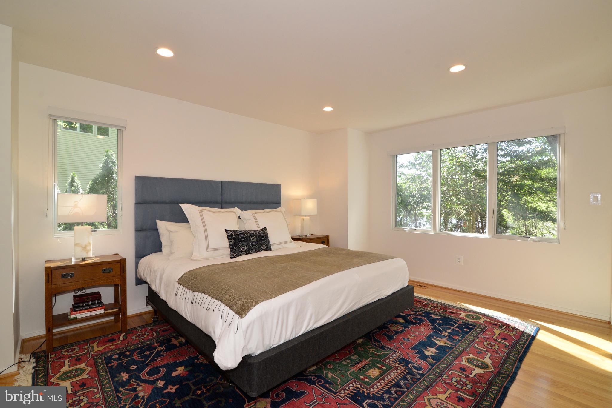 2262 Compass Point Lane Reston, VA 20191 - Photo 32 of 48 a bed sitting in a bedroom next to a window
