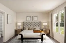 a bedroom with a bed and a lamp next to a window