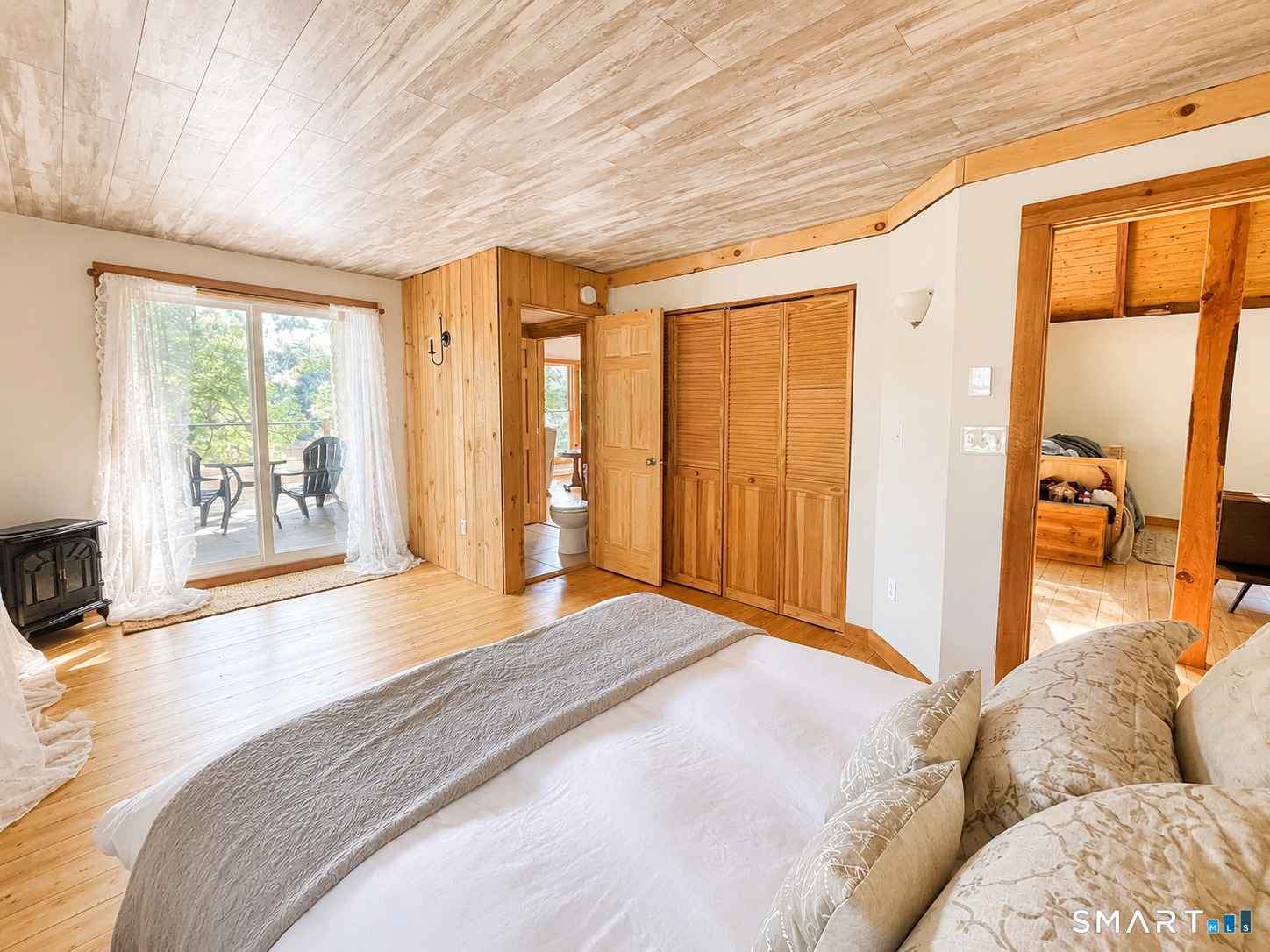 74 Cove Road, Unit 17 Haddam, CT 06424 - Photo 8 of 39 a spacious bedroom with a large bed and a large window