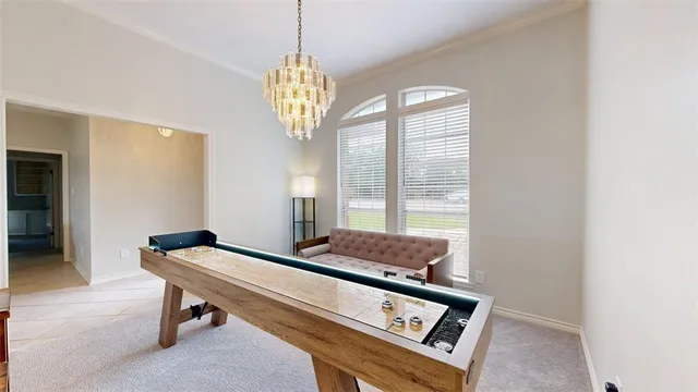 a room with chandelier furniture and windows