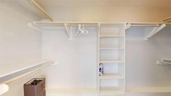 a view of an empty walk in closet