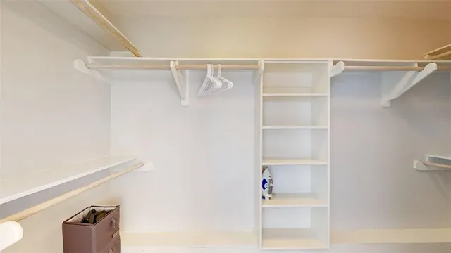 a view of an empty walk in closet