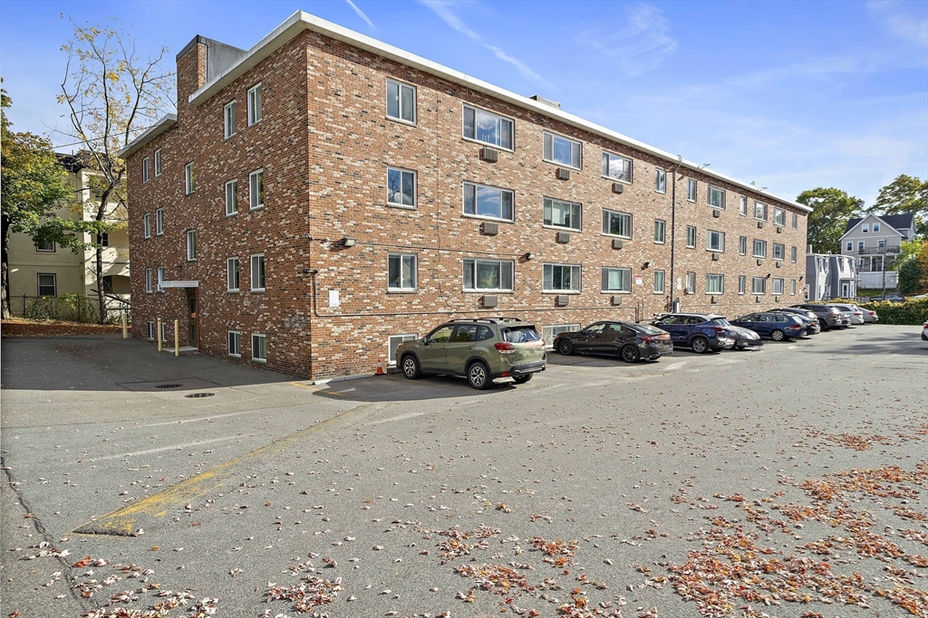 20 Radcliffe Road, Unit 112 Boston, MA 02134 - Photo 12 of 13 a view of a parked cars in front of a building