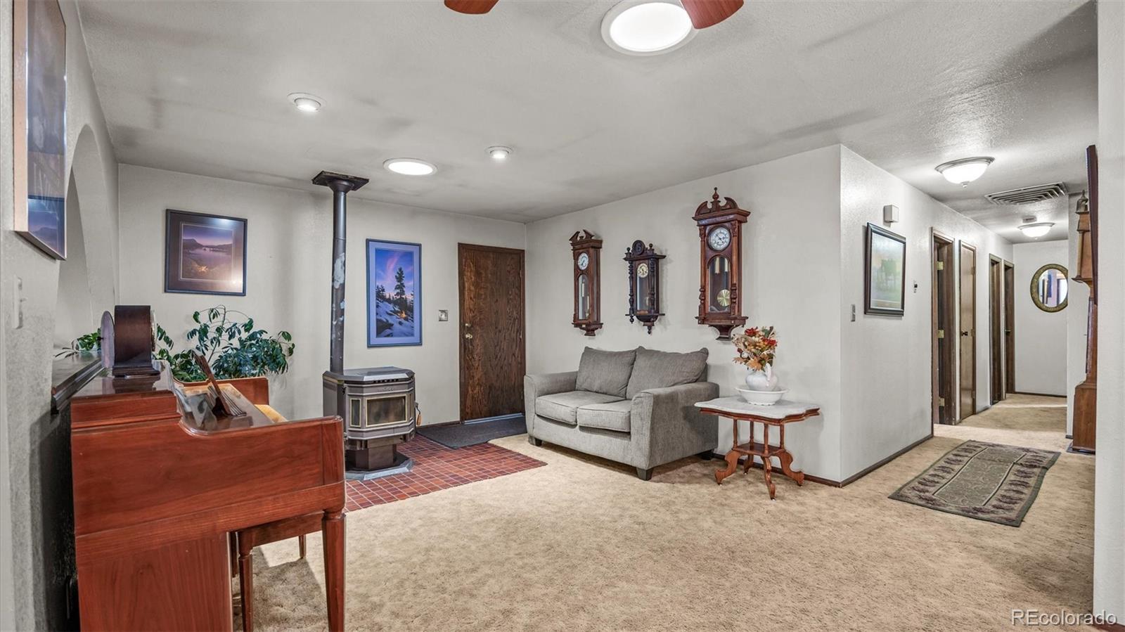 1473 17 Road Fruita, CO 81521 - Photo 21 of 35 a living room with furniture and a wooden floor