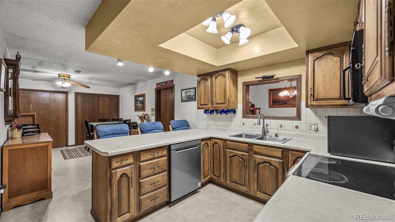 1473 17 Road Fruita, CO 81521 - Photo 23 of 35 a kitchen with a sink appliances and cabinets