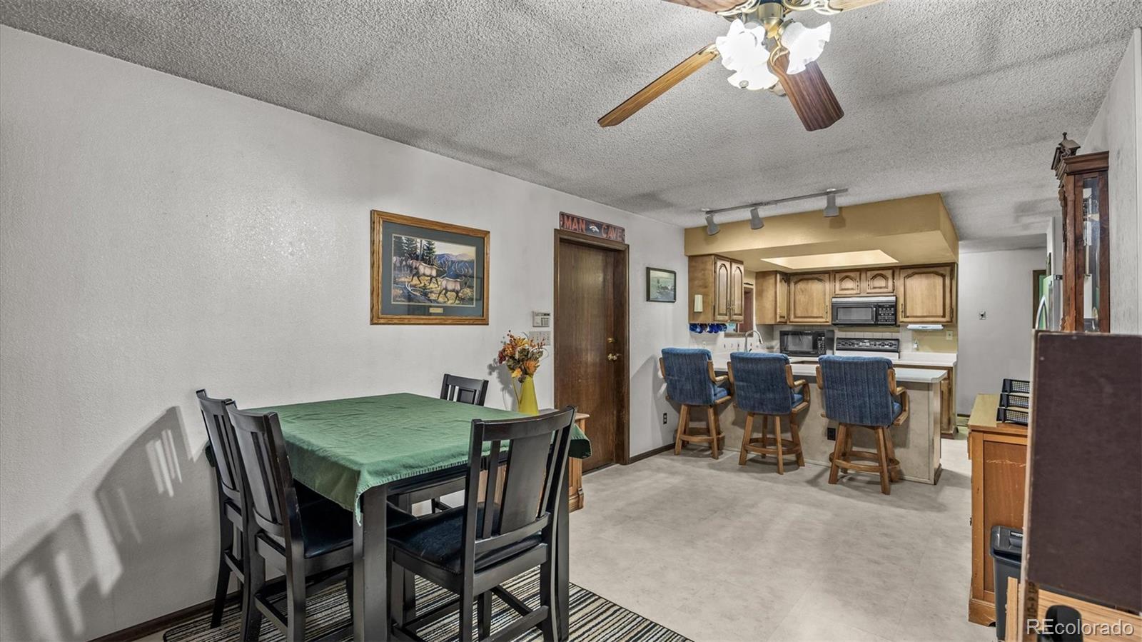 1473 17 Road Fruita, CO 81521 - Photo 26 of 35 a view of a dining room with furniture and chandelier