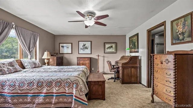 a bedroom with a bed a desk and chair