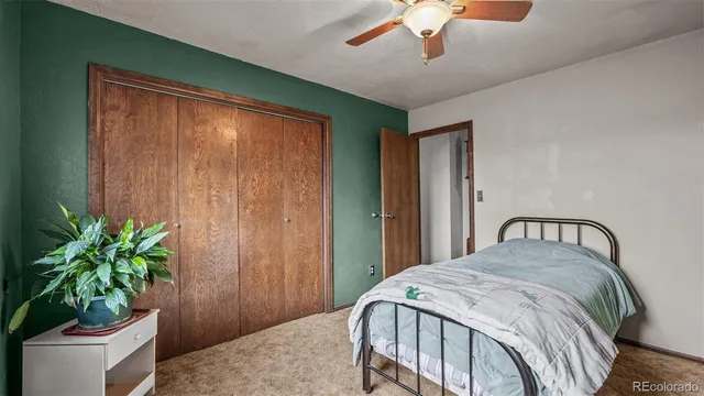 a bathroom with a granite countertop double vanity sink and a mirror