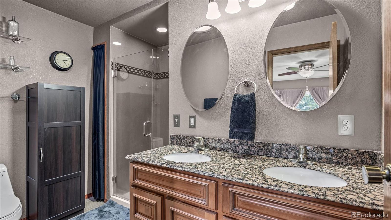 1473 17 Road Fruita, CO 81521 - Photo 34 of 35 a bathroom with a granite countertop double vanity sink and a mirror