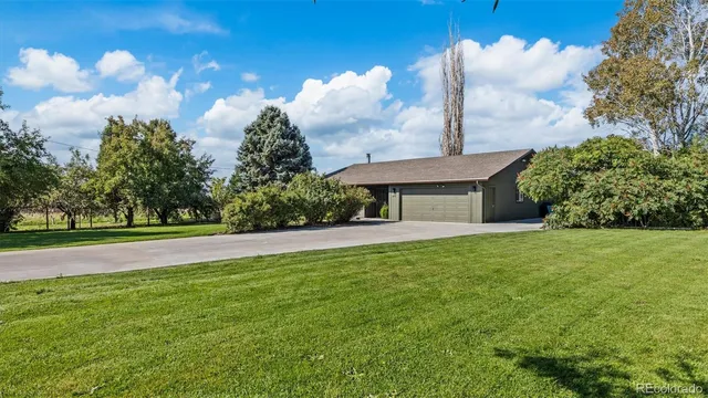 a backyard of a house with potted plants