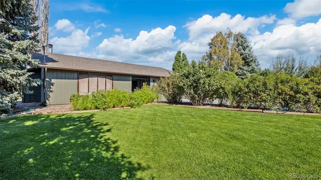 a front view of house with garden