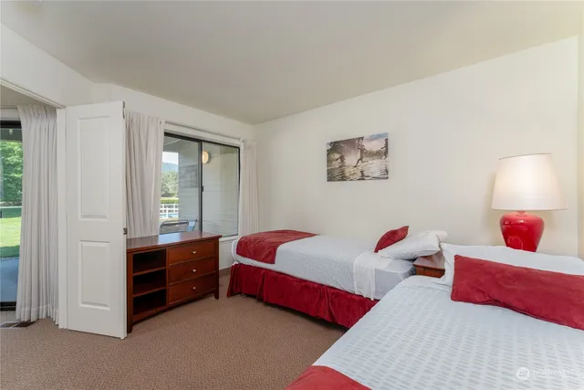 a bedroom with bed and window