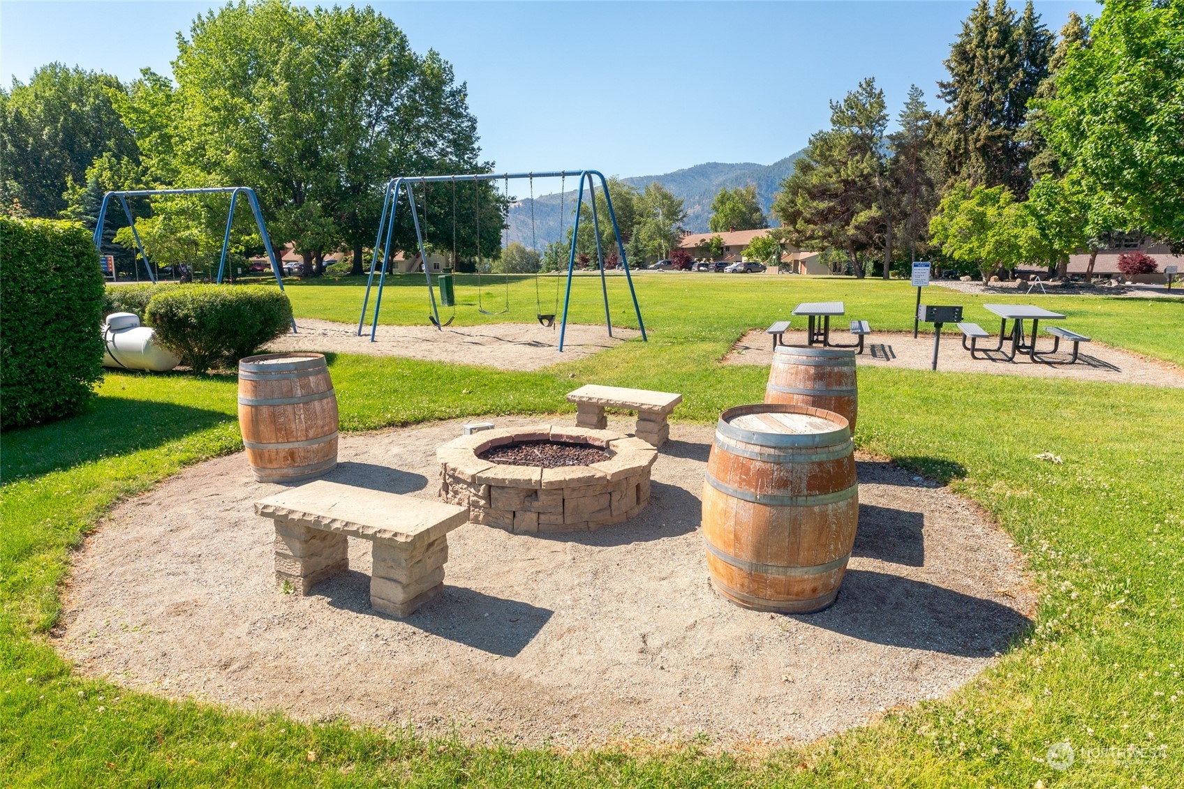 1 Tennis 651-e2 Manson, WA 98831 - Photo 17 of 40 a view of a garden with a fountain and a lake view