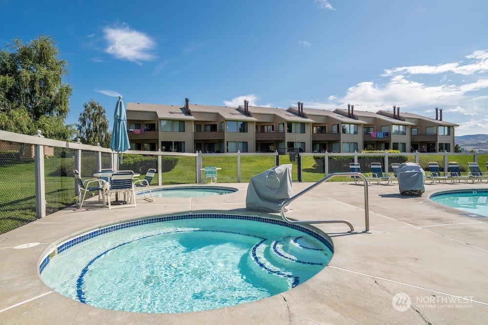 1 Tennis 651-e2 Manson, WA 98831 - Photo 19 of 40 a view of a swimming pool with a patio