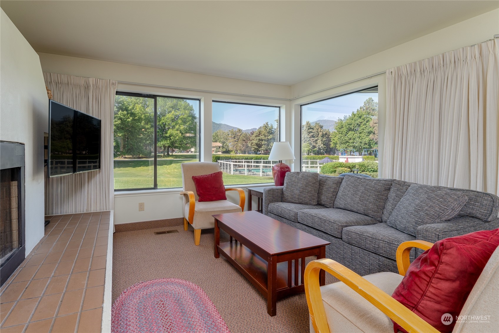 1 Tennis 651-e2 Manson, WA 98831 - Photo 2 of 40 a living room with furniture and a flat screen tv