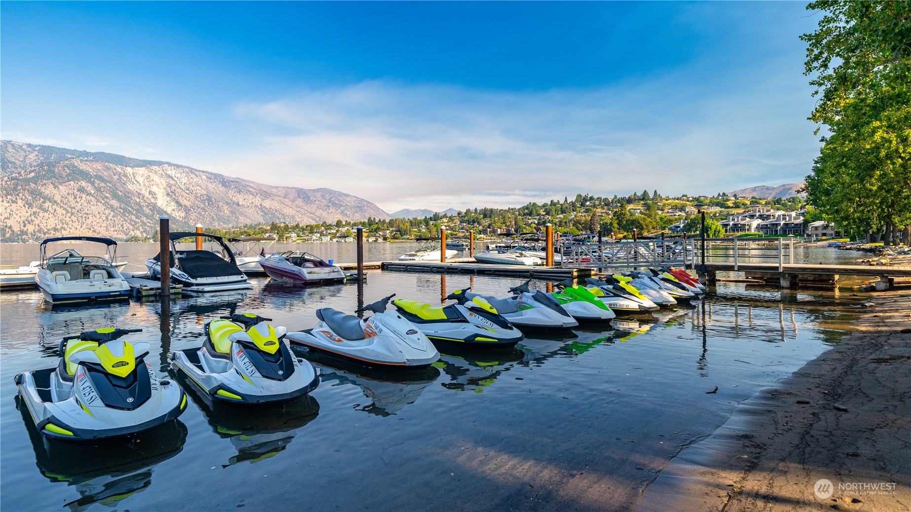 1 Tennis 651-e2 Manson, WA 98831 - Photo 27 of 40 a view of a swimming pool with lounge chairs