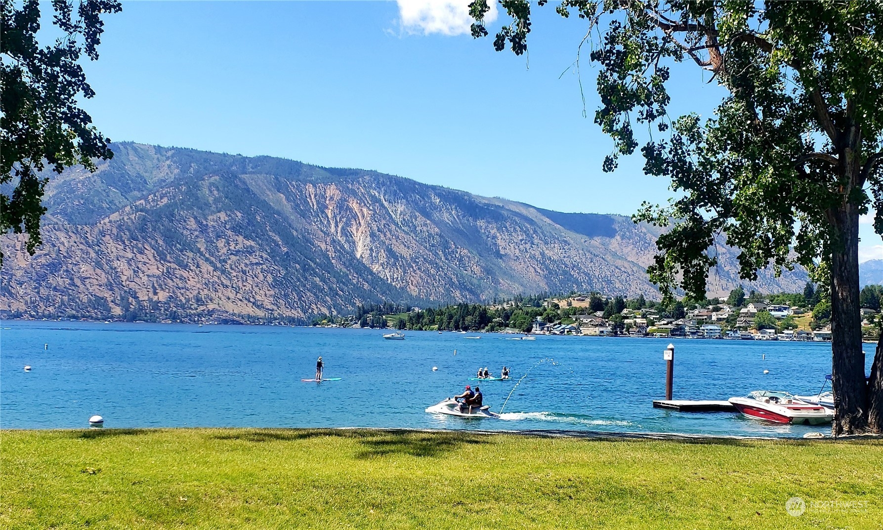 1 Tennis 651-e2 Manson, WA 98831 - Photo 30 of 40 a view of a swimming pool with a yard
