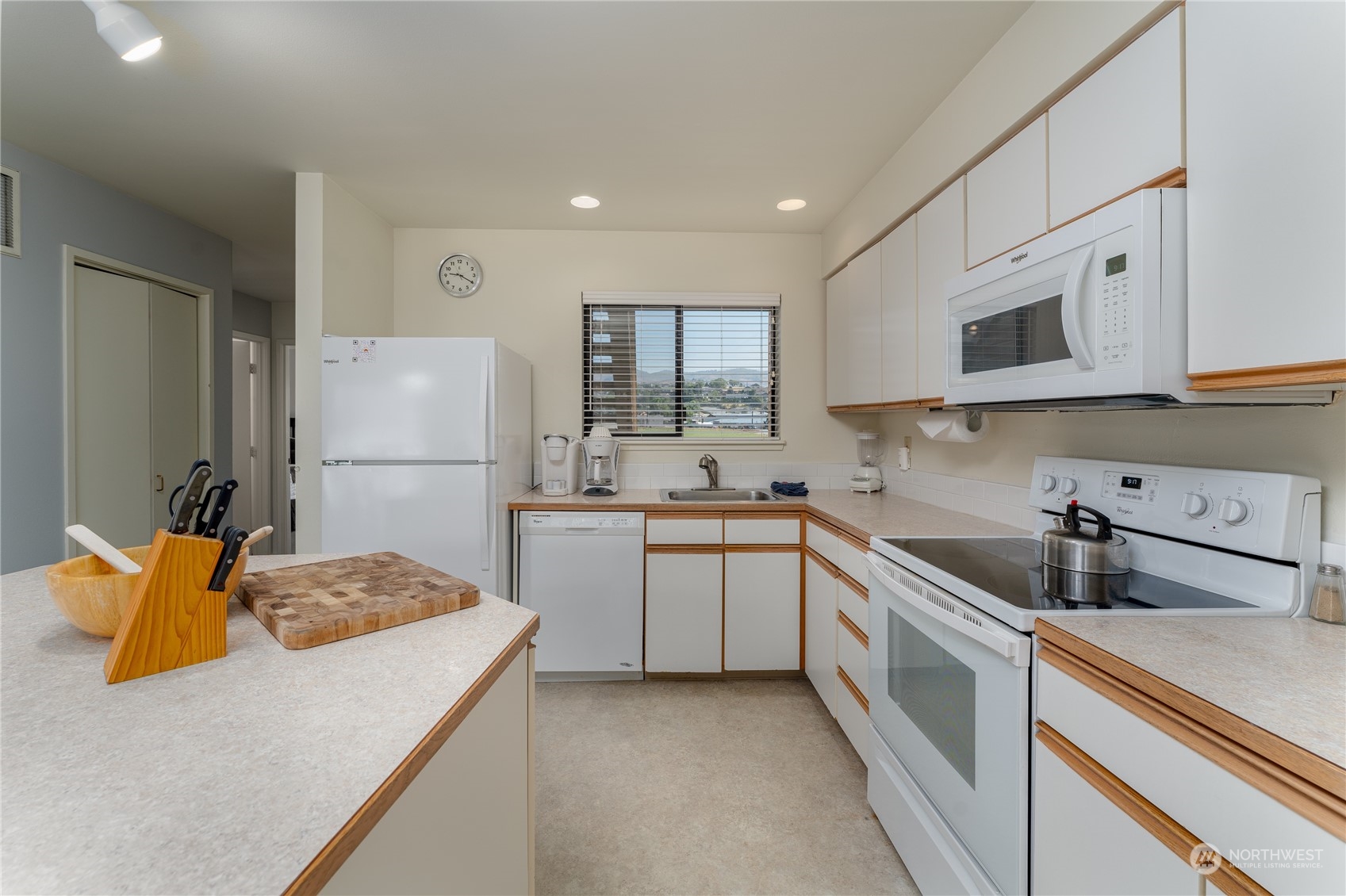 1 Tennis 651-e2 Manson, WA 98831 - Photo 7 of 40 a kitchen with a sink a refrigerator and cabinets