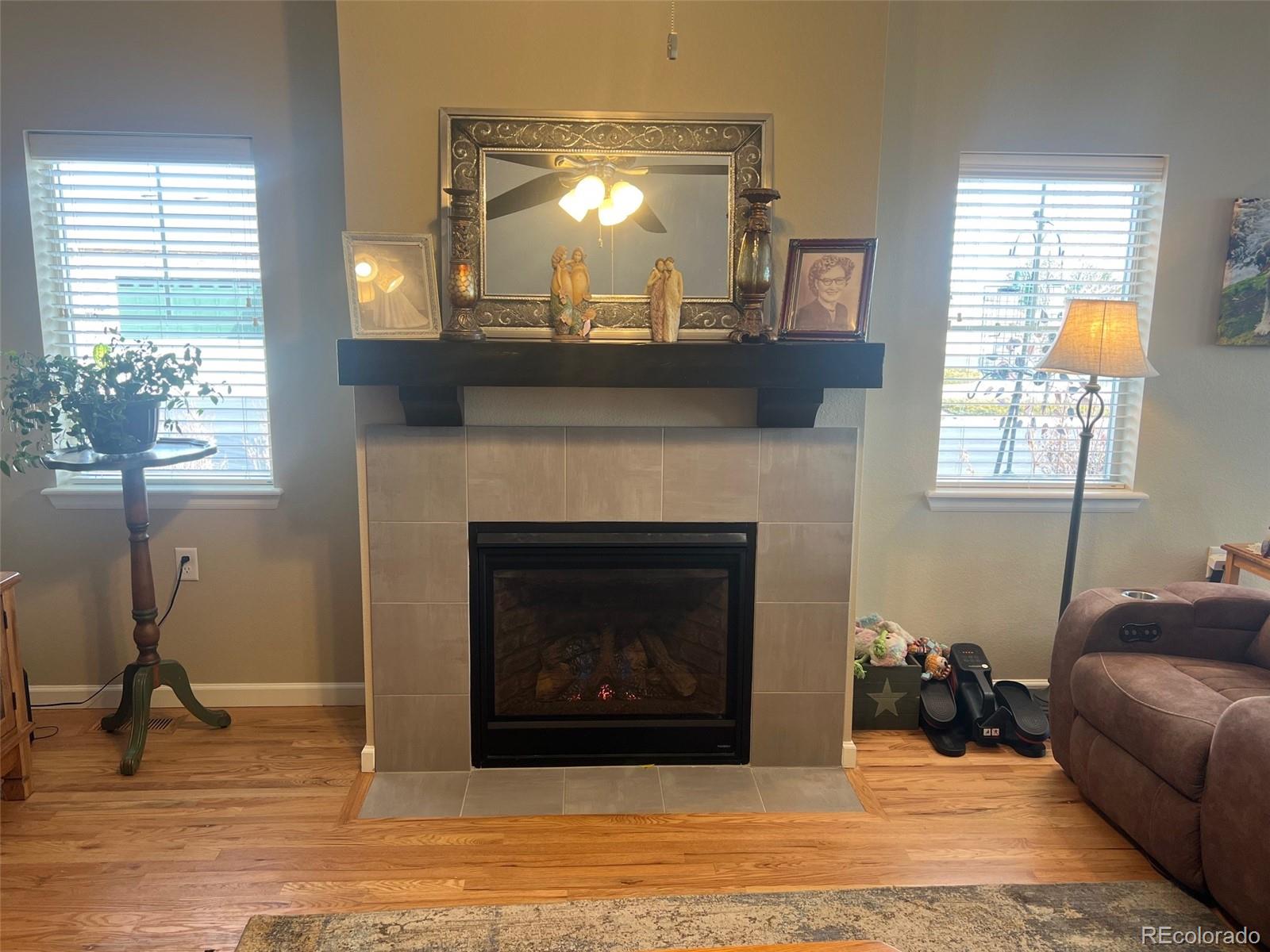 2029 South Flanders Way, Unit B Aurora, CO 80013 - Photo 19 of 42 a living room with furniture and a fireplace